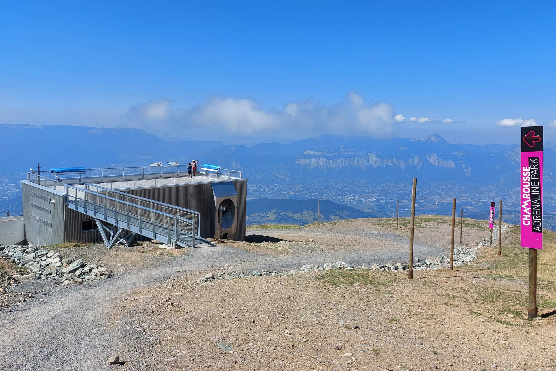 Chamrousse experience giant zip line direction sign Adrenaline Park summer mountain resort grenoble isere french alps france