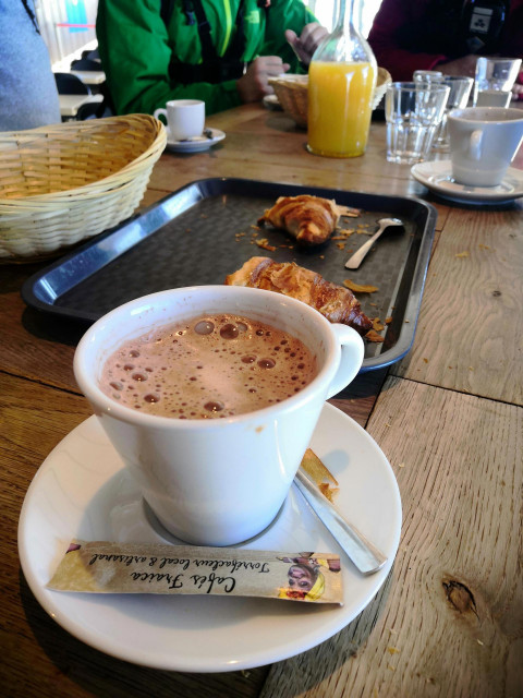 Chamrousse first track experience hot chocolate croissant orange juice at the croix restaurantski patrol job discovery winter resort grenoble isere french alps france