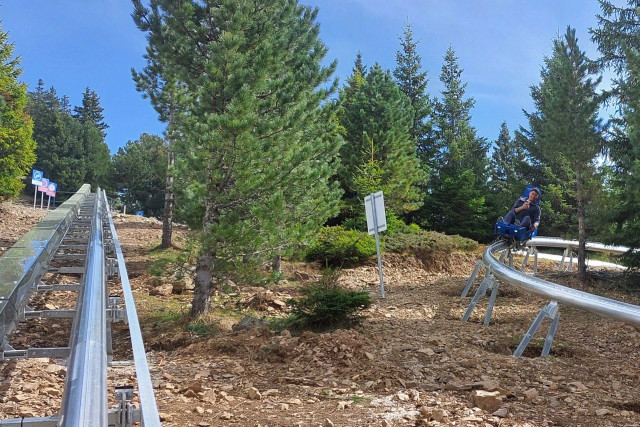 Chamrousse climb and descent sledge rail experience Luge Coaster spring mountain resort grenoble isere french alps france