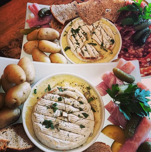 Chamrousse mountain dish camembert cheese oven baked charcuterie potato ski resort mountain grenoble isere french alps france